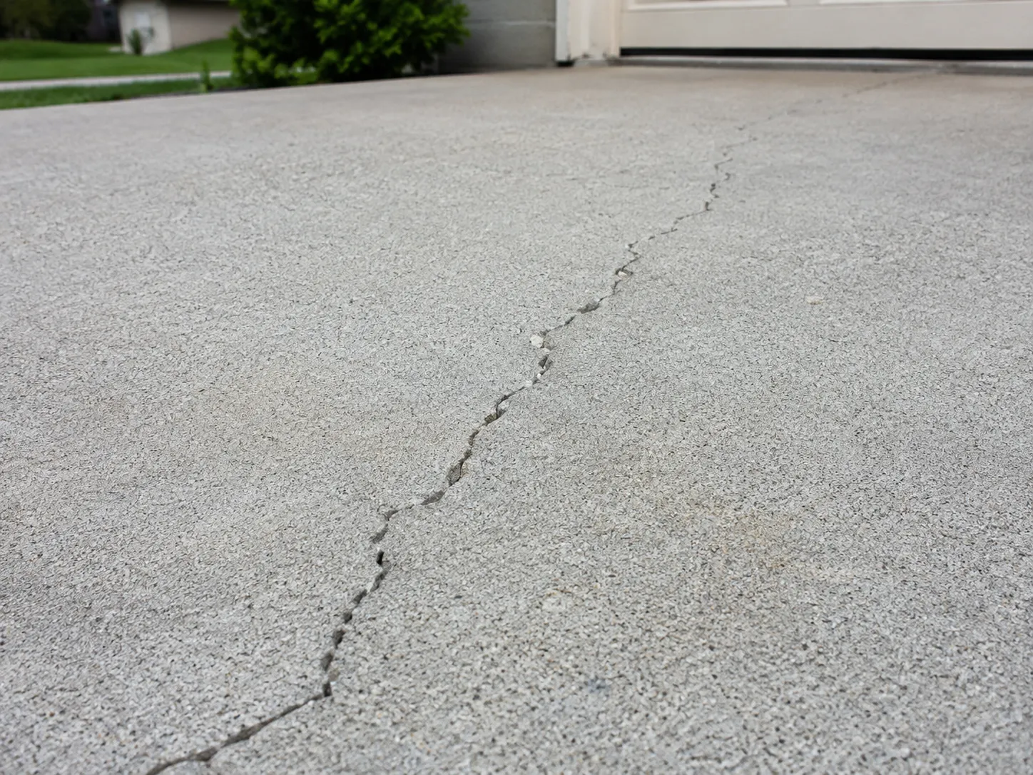 Cracks running across a concrete slab